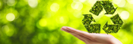 Hand Holding Green Recycle Icon Symbol Made Of Leaves For Ecology And Environmental Conservationの素材