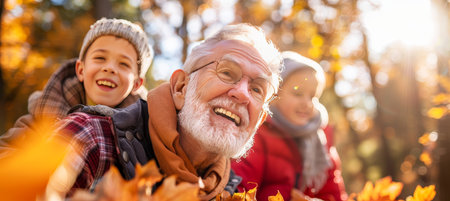 Happy Multigenerational Family Sharing Laughter and Joy amidst Autumn Colors Outdoors.の素材