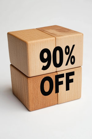 Wooden blocks spelling 90 off, promotion sale discount concept, isolated on a white backgroundの素材