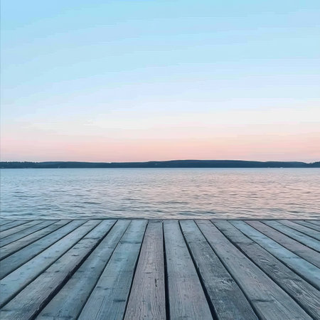 Empty Wooden Pier Overlooking Tranquil Lake at Sunset, Romantic Evening Ambiance on the Waterの素材