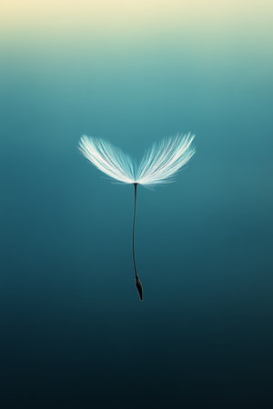Solitary Dandelion Seed Delicate, Wispy Structure Against Tranquil Blue Background, Macroの素材