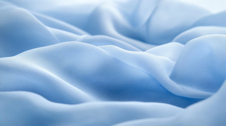 Abstract Background Of Flowing Light Blue Fabric Waves With Light And Dark Areas In Pastel Paletteの素材