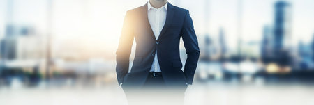 Confident Businessman Stands in Suit with Cityscape Background, Leadership and Success Conceptの素材