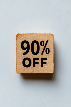 Close-Up, Minimalist Photo of Beige Square with Bold 90 Off Text on White Backgroundの素材