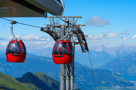 Modern red cable car cabins with a view of the Austrian Alps in Kaprun, Zell am See, Austria