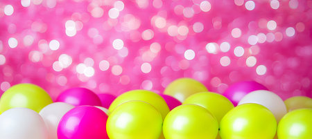 Close Up Of Bright Green And Magenta Balloons With A Blurred Magenta Bokeh Backgroundの素材