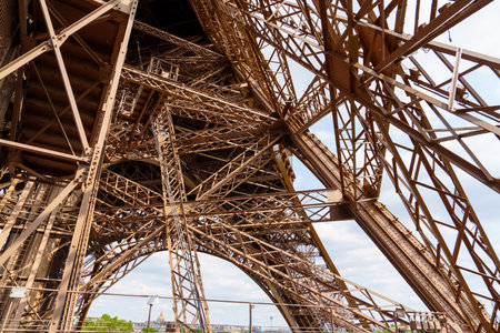 Stunning View of the Eiffel Tower s Intricate Design Under a Clear Blue Sky in Paris, Franceの写真素材