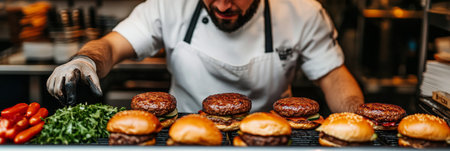 Chef Adds Final Touches to Delicious Burgers, Grilled to Perfection, in a Restaurant Kitchenの素材