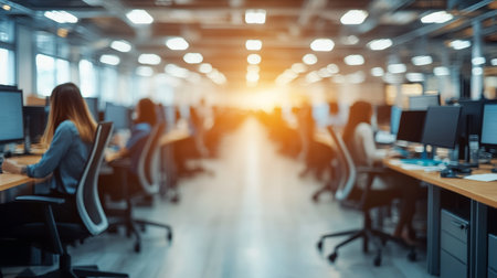 Bright open plan office, rows computers, blurred background, sunny day, corporate business conceptの素材