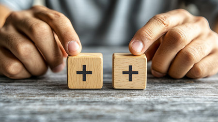 Decision Making Hands Choosing Between Two Wooden Blocks with Plus Signs, Concept of Positivityの素材
