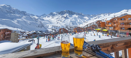 Winter Wonderland Sipping Craft Beer with Scenic Mountain Views at Chalet Bar Apres-Skiの素材
