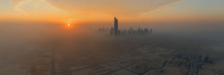 Golden Sunrise over Misty City Skyline, Modern Skyscrapers Pierce the Fog above the Urban Sprawlの素材