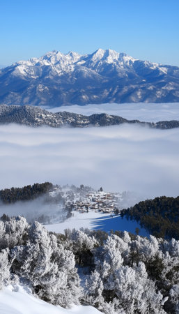 Winter Wonderland Snow-Capped Mountain Peaks, Valley Covered With a Sea of Clouds, Scenic Landscapeの素材