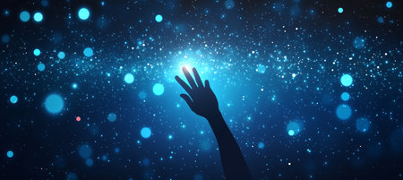 Reaching for the Stars Silhouette of Hand Grasping for Bright Lights Against Night Skyの素材