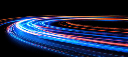 Abstract, Vibrant Electric Blue And Red Light Trails On A Curved Road, Motion Blur Effectの素材