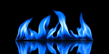 Mystical Blue Flames Dancing on a Black Background With Reflection, Perfect for Copy Spaceの素材