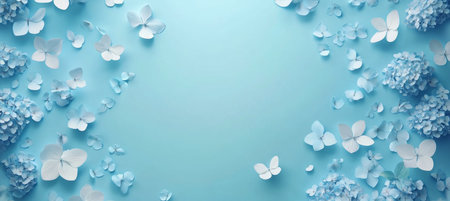 Blue Hydrangea Flowers and Paper Butterflies Arranged on a Pastel Blue Background With Copy Spaceの素材