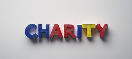 Colorful Wooden Letters Spelling CHARITY on White Background, Concept of Giving and Philanthropyの素材
