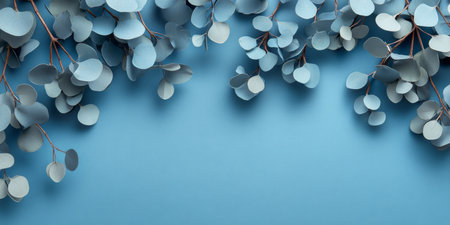 Eucalyptus Branches Frame on Blue Background With Copy Space. Floral Composition Design Concept.の素材