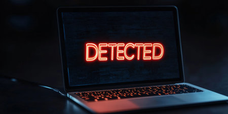 Laptop Computer With A Detected Warning Message Illuminated On The LCD Screen In The Darkの素材