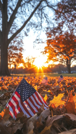American Flags In Autumn Leaves, Honoring Veterans On Memorial Day Or Veterans Day At Sunsetの素材