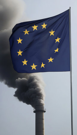 EU Flag Waving with Industrial Smokestack and Pollution Emissions, Environmental Policy Concernの素材