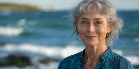 Portrait Of Happy Smiling Senior Woman With Natural Grey Hair Posing On Sea Travel Nature Backgroundの素材