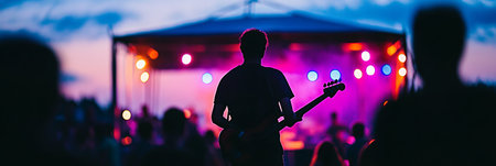 Silhouette of Musician on Stage, Blurred Concert Crowd, Colorful Stage Lights, Eveningの素材