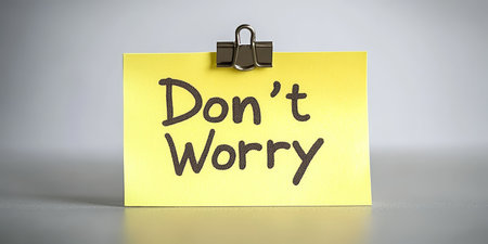 Don t Worry Sign On A Yellow Sticky Note With Paper Clip. Encouragement Handwritten Message Concept.の素材