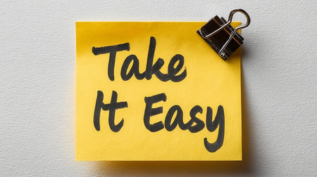 Take It Easy Note. Yellow Sticky Note With Motivational Text, Isolated On White Background.の素材