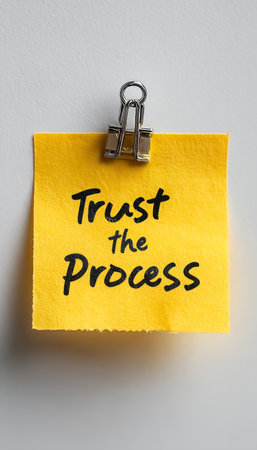 Isolated Yellow Sticky Note On White Background With The Motivational Quote Trust The Processの素材