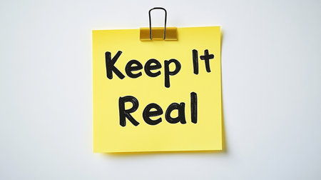 Yellow Sticky Note With the Inspirational Phrase, Keep It Real, On a White Backgroundの素材