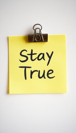 Stay True Yellow Sticky Note on White Background, Concept for Truth and Authenticityの素材