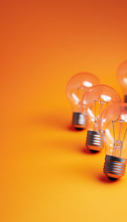 Illuminate Ideas, Bulbs on Vibrant Backdrop, Space for Creative Text and Artistic Designs, Orangeの素材