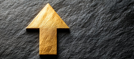Golden Arrow Ascending on Dark Granite Background, Symbolizing Ambition, Goals, and Forward Momentumの素材