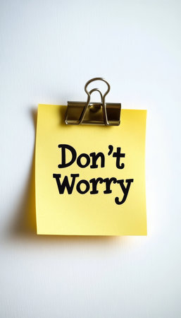 Yellow Sticky Note with Don t Worry Message, Isolated on White Background With Copy Spaceの素材
