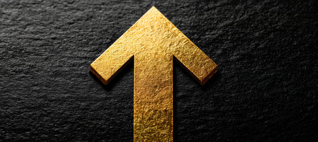 Golden success arrow pointing up, symbolizing growth and optimistic financial potential.の素材