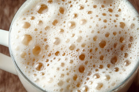 Delicious Milkshake in a Frothy Mug Surrounded by Tempting Toppings and Soft Focus Backgroundの素材