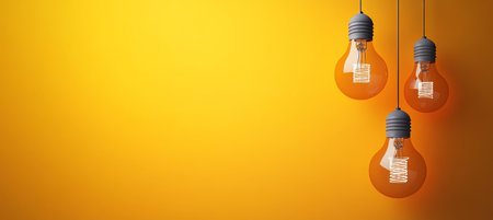 Energy Efficient Light Bulbs on Orange Surface, Creative Bright Future Ideas and Design Conceptsの素材