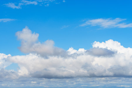 Majestic Sky Panorama Expansive Blue Canvas Adorned with Billowing White Clouds Formationの写真素材