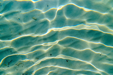 Underwater Sand Ripples with Sunlight Reflections, Ocean Floor Texture Abstract View