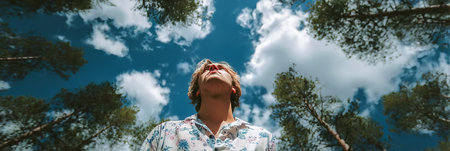 Young Man s Peaceful Escape in a Lush Forest, Breathing in Fresh Air Under a Beautiful Canopyの素材