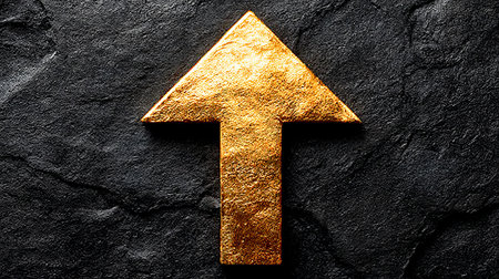 Stunning Gold Arrow Symbolizing Achievement and Prosperity on a Black Textured Background Imageの素材