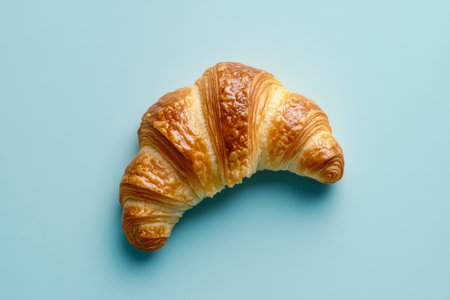Deliciously Flaky Croissant on Colorful Backdrop, Perfect for Breakfast or Bakery Display Shotの素材