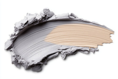 Smear Foundation Beauty Product Showing Gray and Beige Strokes on a White Background Isolatedの素材