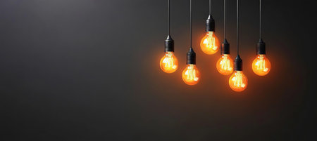 A Creative Workspace with Glowing Lightbulbs and Dark Walls, Inspiring Innovative Ideas and Designsの素材