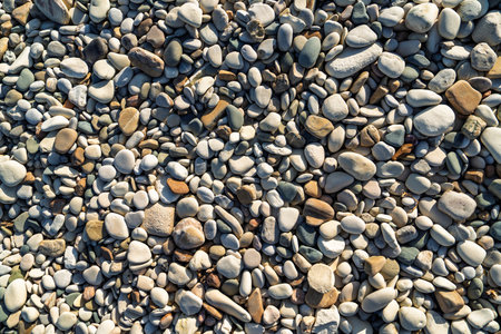 Natural Abstract Background of Smooth Beach Stones, Perfect for Textures and Designの写真素材