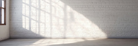 Bright and Sunlit Interior Featuring White Brick Wall and Wooden Floor with Window Shadowsの素材