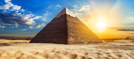 Breathtaking View of the Great Pyramid of Giza Surrounded by Clear Blue Sky and Desert Landscapeの素材