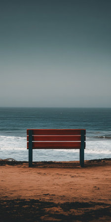 Serene Coastal View at Tranquil Beach with Vacant Wooden Bench and Peaceful Ocean Horizon Landscapeの素材